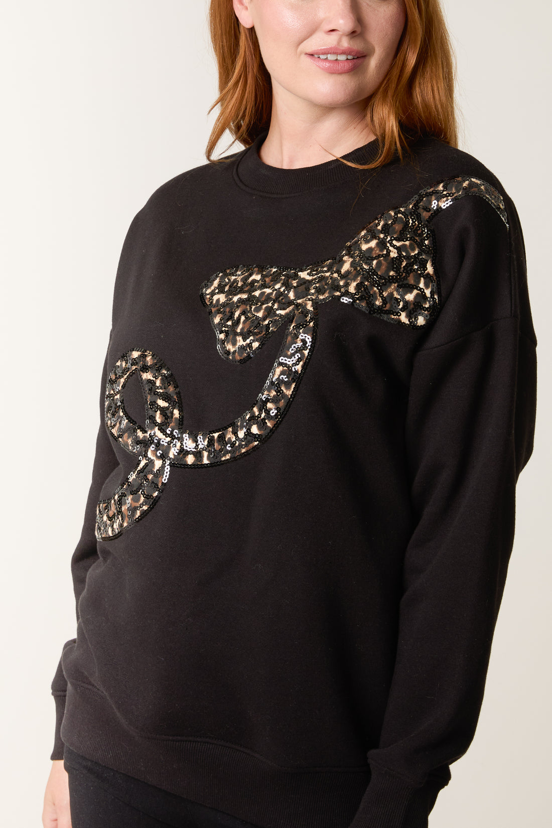 The Roxy — Sequin Animal Print Bow Sweatshirt